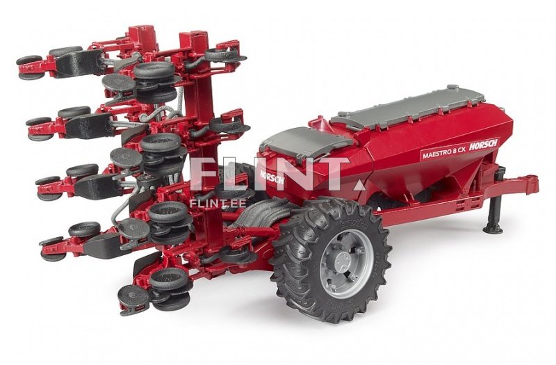 Punane traktoriaga seemne külvaja, millel on kaheksakohaline käepide ning reguleeritavad rataste kiirused.