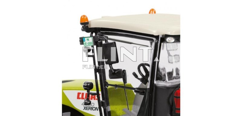 Pilt näitab mudeltraktorit, millel on heleroheline ja must kere. Juhi kabiini kohal on oranž vilkur. Kabiini paremal küljel on väike peegel ja maksimaalne kiirus tähistav märk.