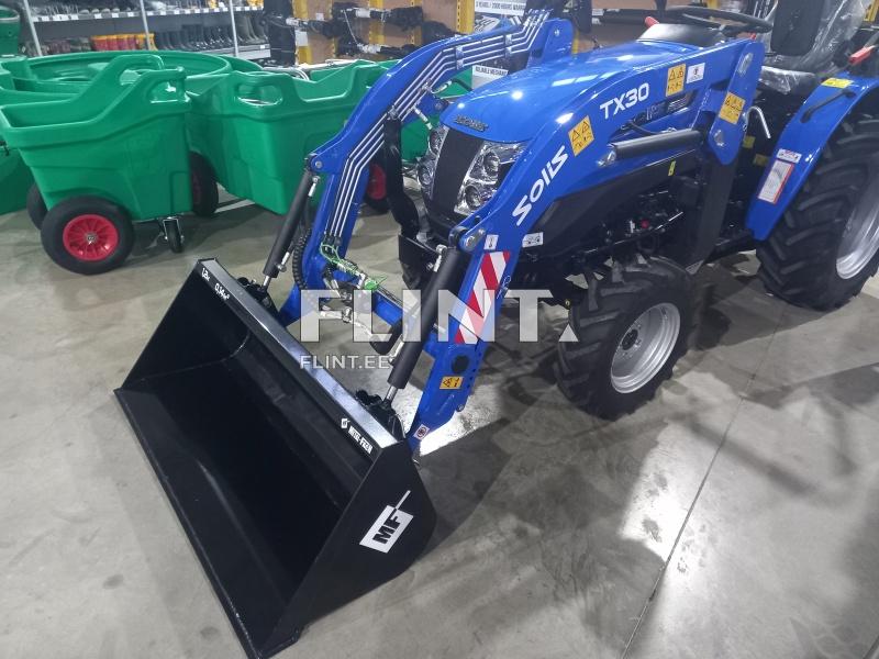 Sinine traktor, millel on ees suur must lumevihm. Tagapool näha rohelisi plastikkäru, millel on punased rattad.