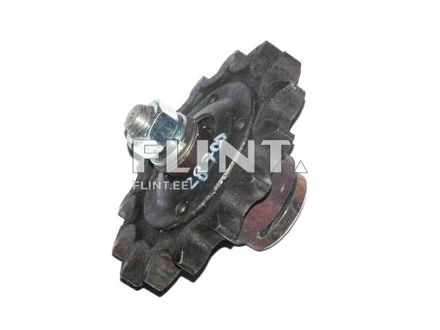 Toote pilt, kus on detail, mis näeb välja nagu hammasratta sarnane objekt. See on ümmargune, keskel on metallist mutter ja musta värvi hambaosadega väliskäik.