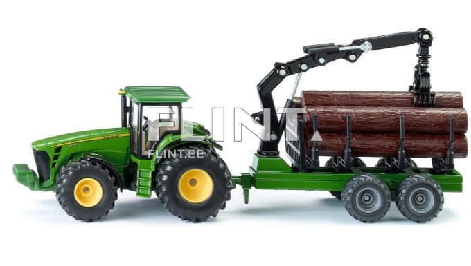 Roheline traktor, millele on paigaldatud puude vedamiseks mõeldud haagis. Haagisel on kolm pruunikat puutükki ja tõstemehhanism.