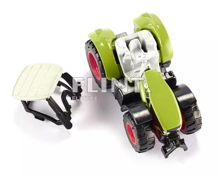 Roheline traktori mudel, millel on punaste ratastega must alus. Üks iste on eraldi kõrval.