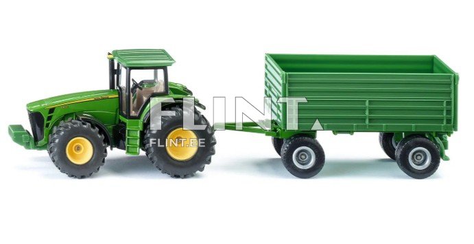 Roheline traktor, millel on mustad rattad, on haagisega ühendatud. Haagis on roheline ja ruudukujuline.