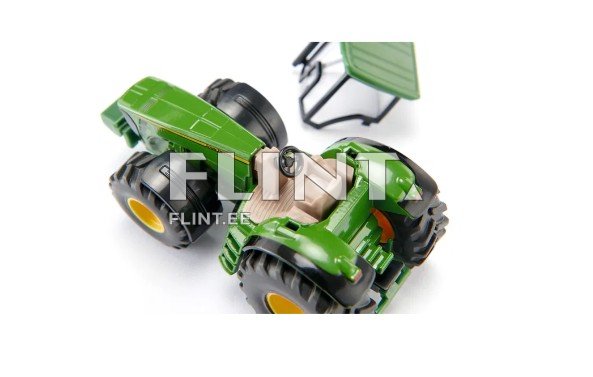 Roheline traktori mudel, millel on mustad rehvid ja kollased veljed. Juhtimisosa on hele ja asub keskel, ning seal on rool. Tagapool on tühja kattega hood, mis on kergelt kallutatud.