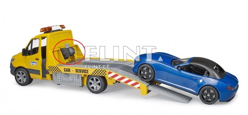 Kollane haagiste auto, millel on mustad rehvid ja katusel punane vilkur. Sõiduki tagaosa on alumiiniumist ja sellel on kehv tekstuur, mis imiteerib karedat põhja. Tagasillaga on sinine sõiduauto, mille rihm on kinnitatud haagiste auto tõsteseadmest.