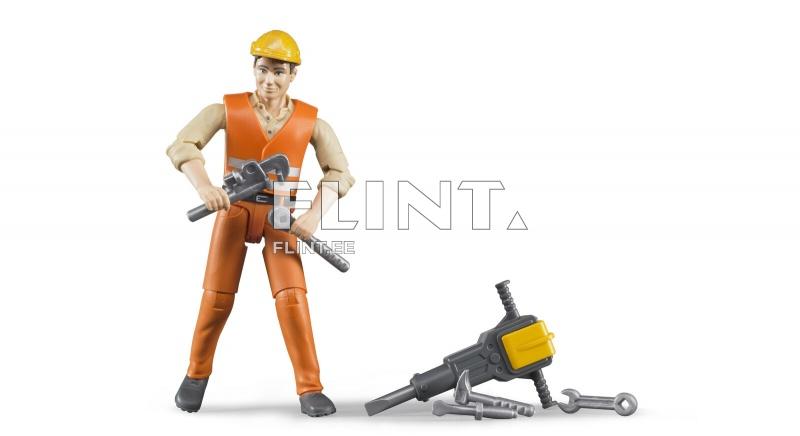 Käekott, millel on kummipõhja all olev kaheksajala kujundus, millel on terve rida tööriistu. Töötaja hoiab kätetööriista ja vaatab otse ees.