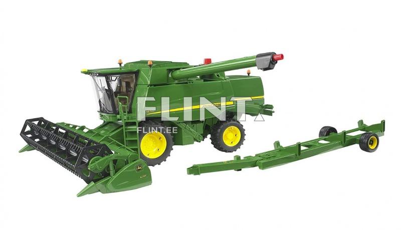 Roheline kombain, millel on must lõikeseade, asub tahapoole. Külgedele on paigaldatud kahte tüüpi rattad ja ülemine osa sisaldab kaevandustorud.