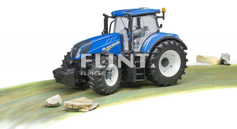 Sinine traktor seisab rohelisel teel, millel on mõned kivid. Traktoril on suurte rehvidega ja detailne kere.